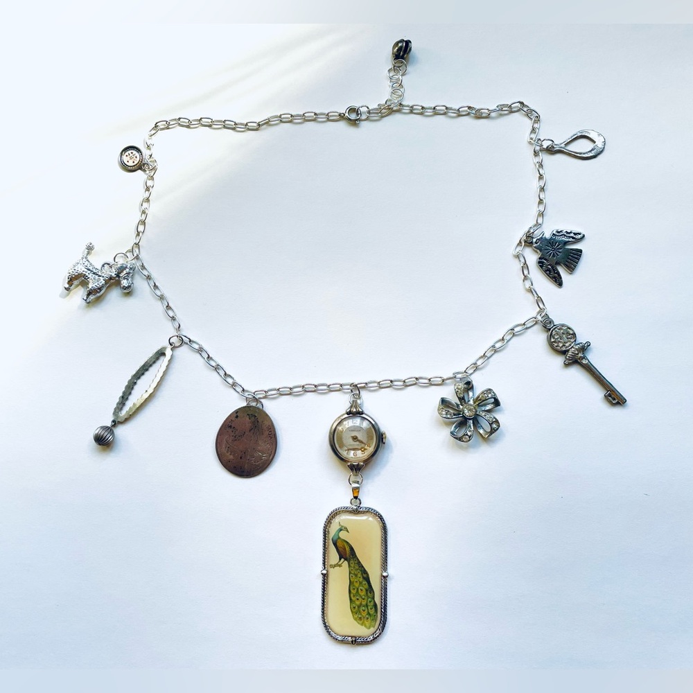 Silver Found Object Charm Necklace With Peacock Charm